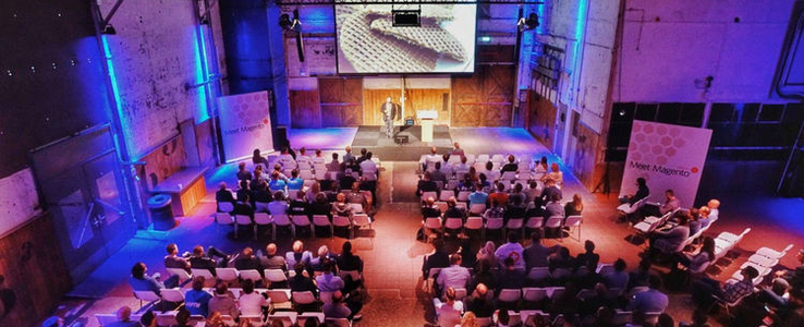 Audience and stage during a MaxServ event